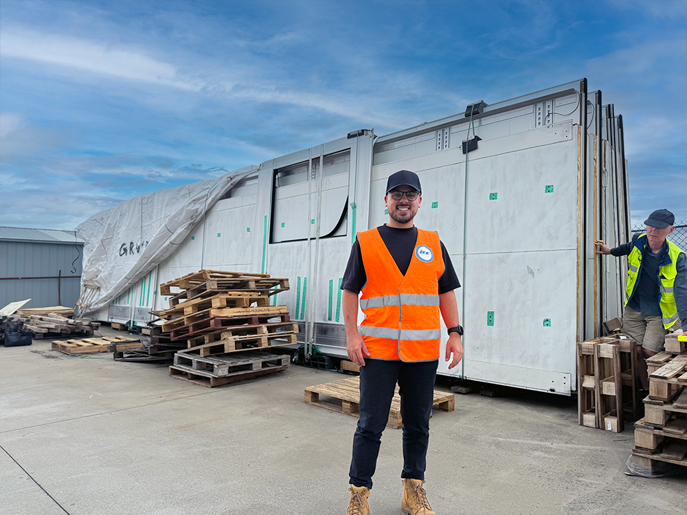 project cargo manager in front of cargo at manufacturers yard