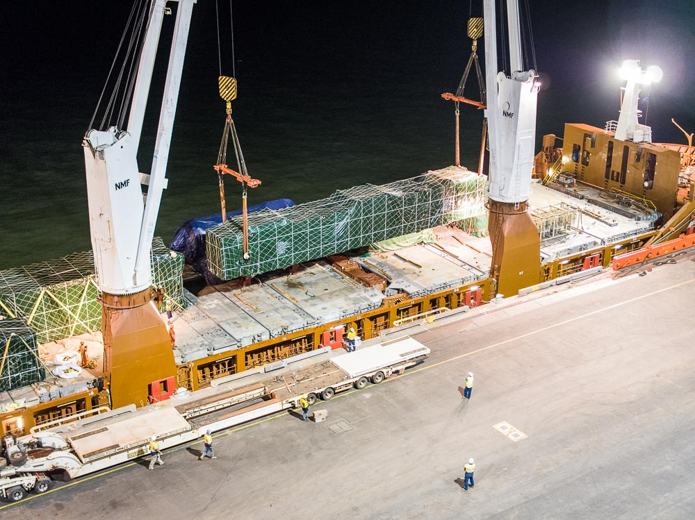 crane lift of heavy cargo onto the vessel for sea freight