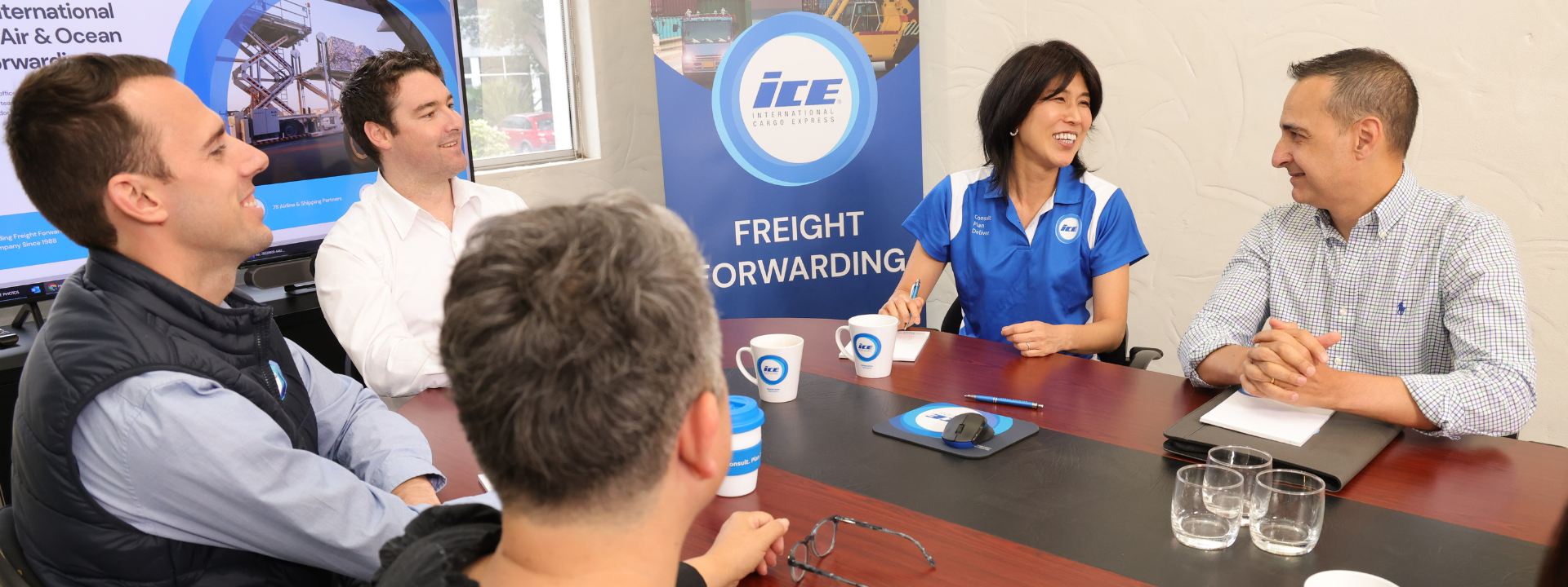 air and ocean freight forwarders in a boardroom meeting