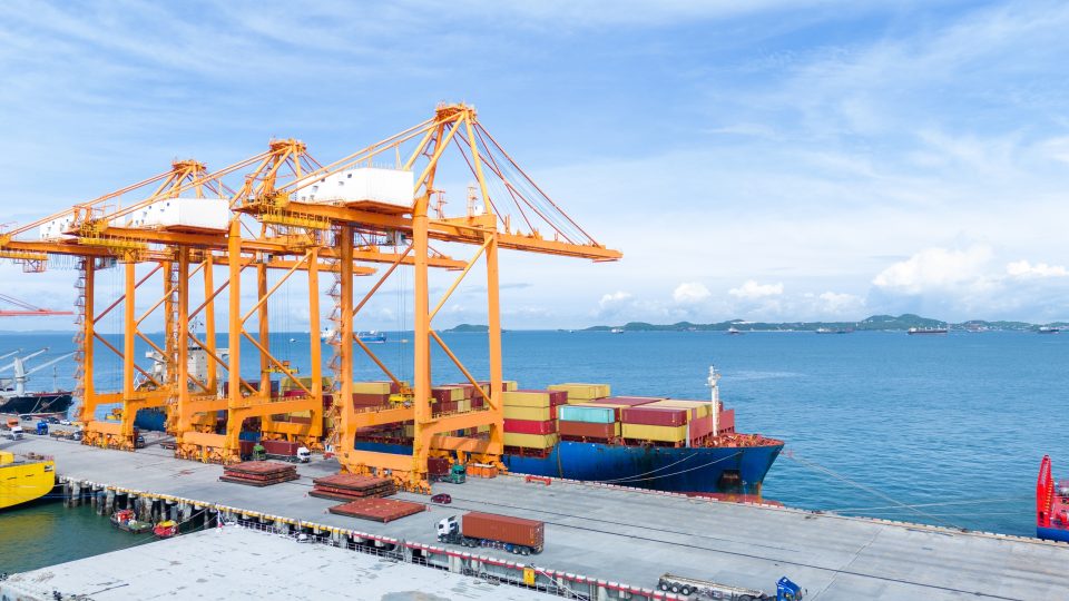 cranes on a busy shipping port